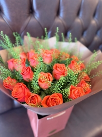 Orange roses with penny cress