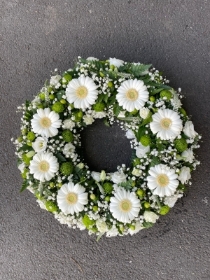 White and green open wreath tribute